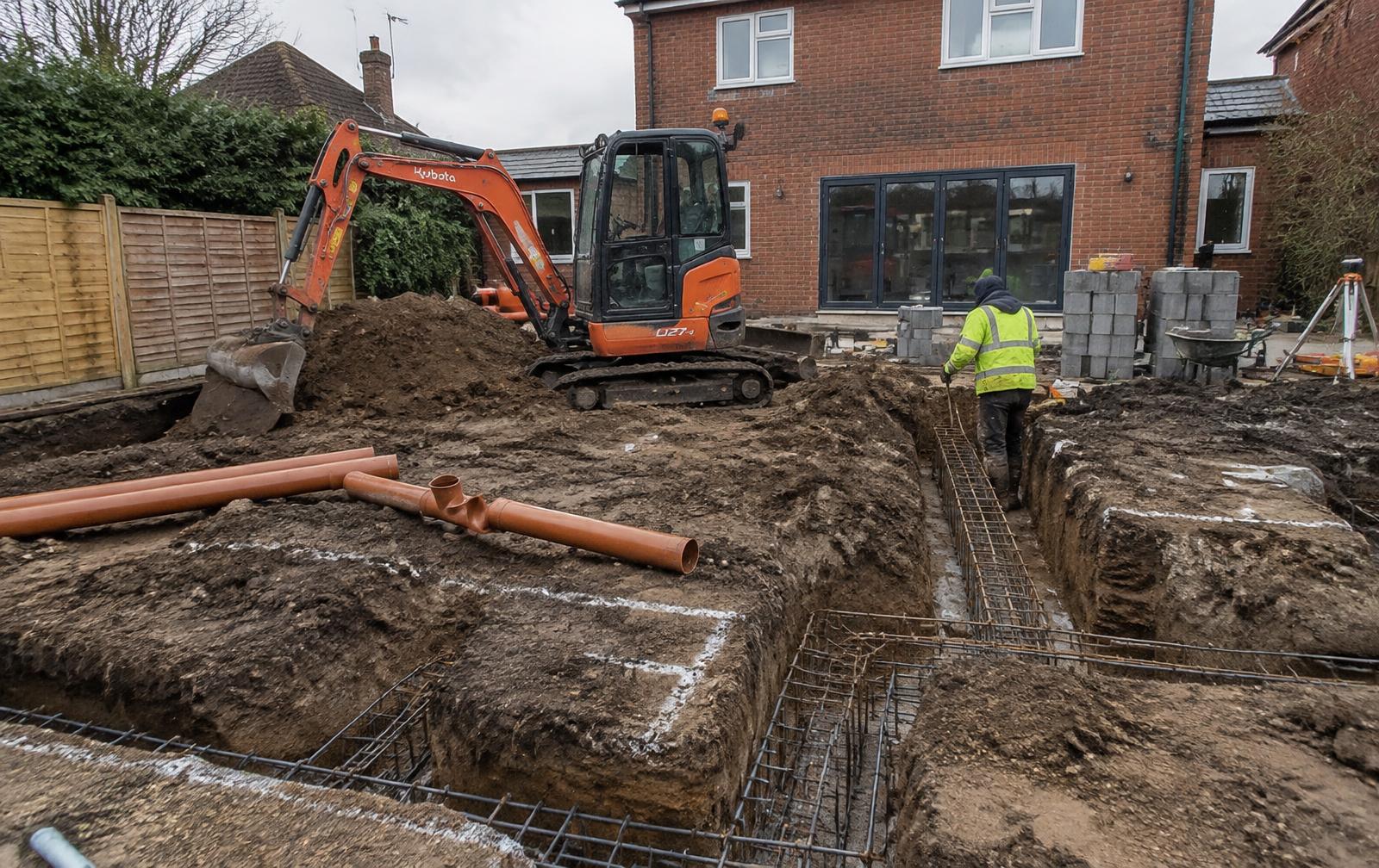 Groundworks contractors digging extension foundations in Manningtree, Essex
